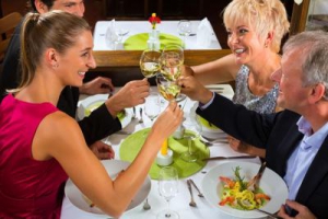 Two couples toasting